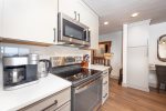 The newly renovated kitchen features high end appliances and beautiful cabinetry.
